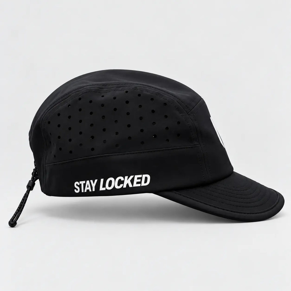 Nonnegotiable Flow black running cap, side view with STAY LOCKED print and perforated panels